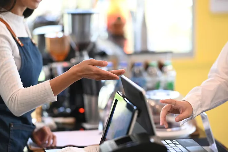 Retail team member receiving practical POS system training